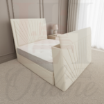 Modern grey sunburst upholstered TV bed with electric lift mechanism in a contemporary bedroom.