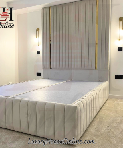 Tall floor standing headboard bed in cream velvet with gold metal strips