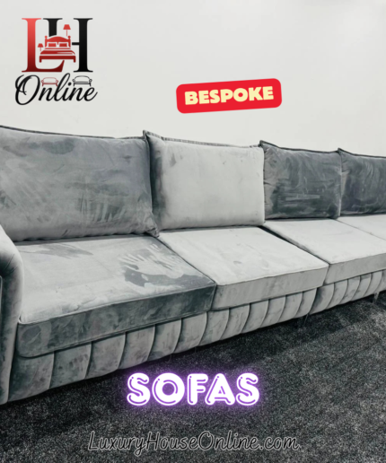 Silver velvet corner sofa with chrome arm details and fluted base tufting
