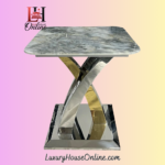 The Lucy Coffee Table is a bold centrepiece that blends sculptural elegance with modern luxury. Featuring a square marble top and a striking interwoven metal base in chrome and gold finishes, it’s designed to elevate any living space with artistic flair and premium materials. This table is part of the Lucy Collection, which includes a matching Dining Table, Console Table, and Lamp Table, all available with the same signature base and a wide range of interchangeable tops. Whether placed in a luxury lounge, a designer apartment, or a modern showroom, the Lucy Coffee Table delivers timeless style and everyday functionality.