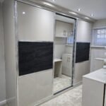 Mirrored sliding doors for sloping ceilings.