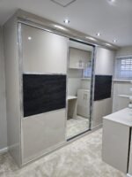 Mirrored sliding doors for sloping ceilings.