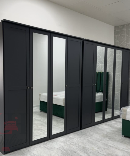 Chalet black mirrored wardrobe with 5 doors in a modern bedroom setting.